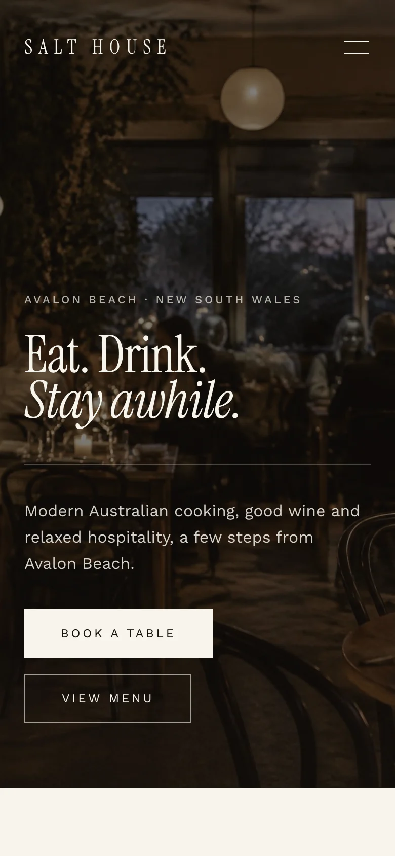 Salt House homepage on a phone, with the hero photograph, headline and Book a Table and View Menu buttons